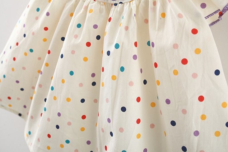 Сукня дитяча у горошок з вишитими квіточками фото