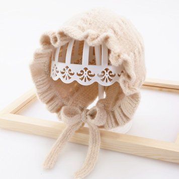Дитяча в'язана шапка з зав'язками (Бежевий 40-46см) фото
